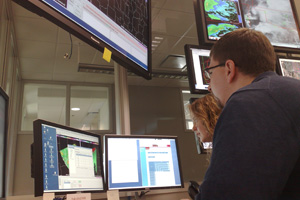 Meteorologists evaluate experimental warning decision-making technologies in the NOAA Hazardous Weather Testbed Operations Area.